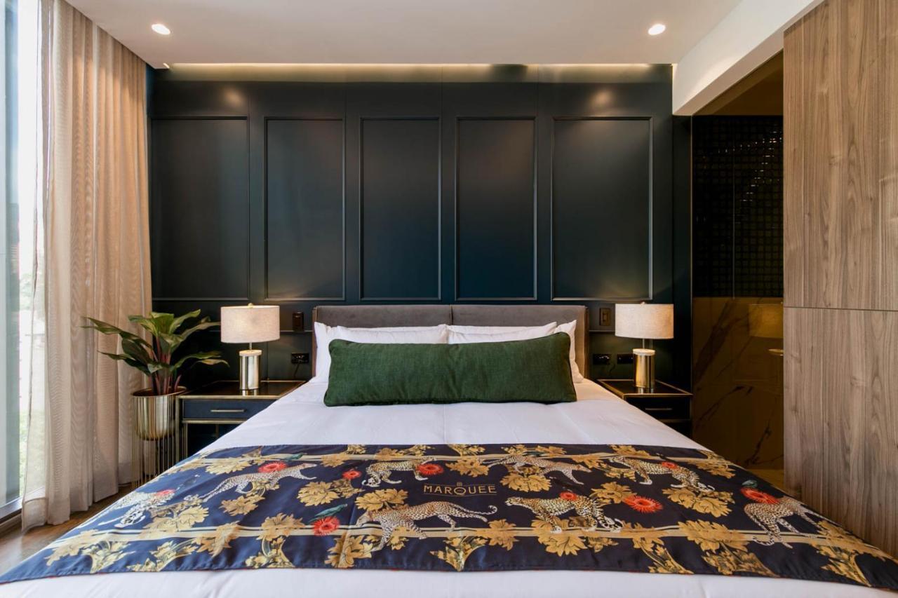 Hotel Marquee ميديلين المظهر الخارجي الصورة A bedroom at the hotel